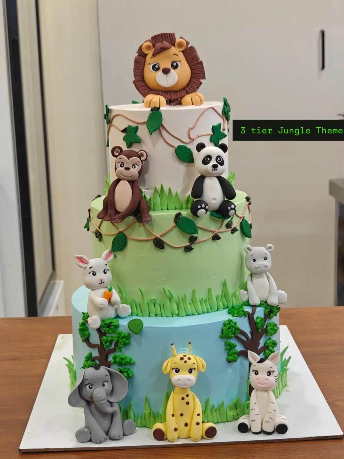 Jungle theme cake with animal toppers