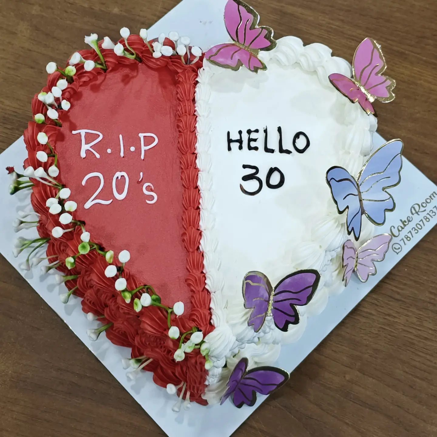 Half red half white butterfly birthday cake